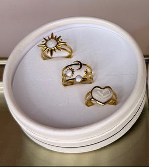 Gold rings in a  box on a reflective surface