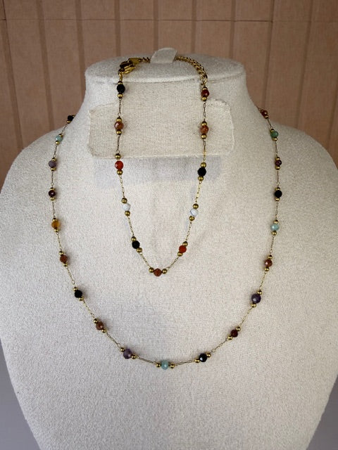 Necklace with multicolored beads and matching bracelet on a mannequin bust