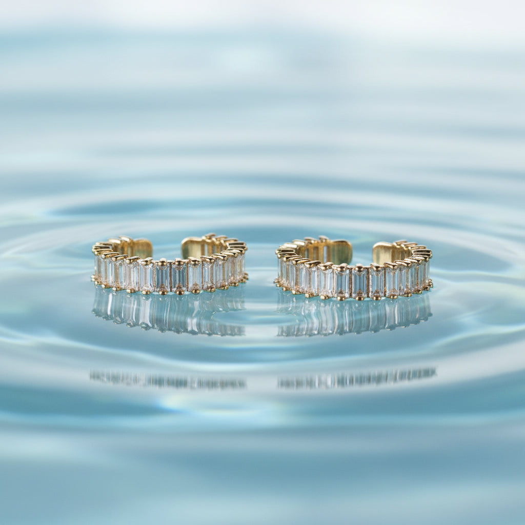 Gold and diamond open rings on a white background