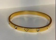 Gold bracelet on a white background