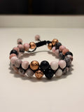 Multicolored beaded bracelet on a plain background