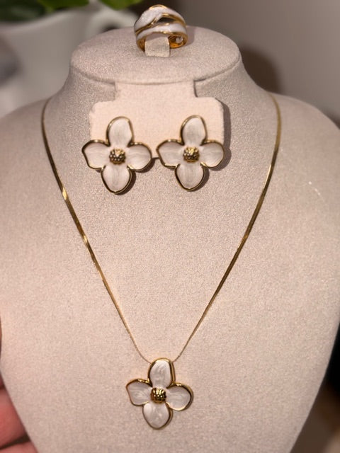 Floral necklace and earrings on a mannequin bust